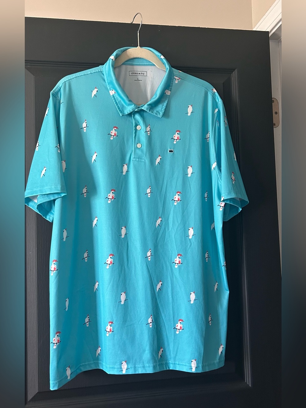 Crown & Ivy blue polo shirt with an all-over bird print.